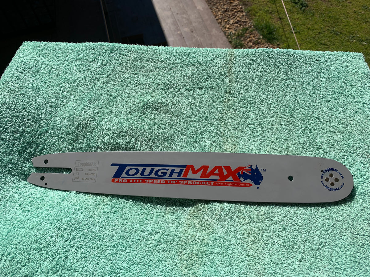 Chainsaw guide bar on outdoor bench, clearance stock