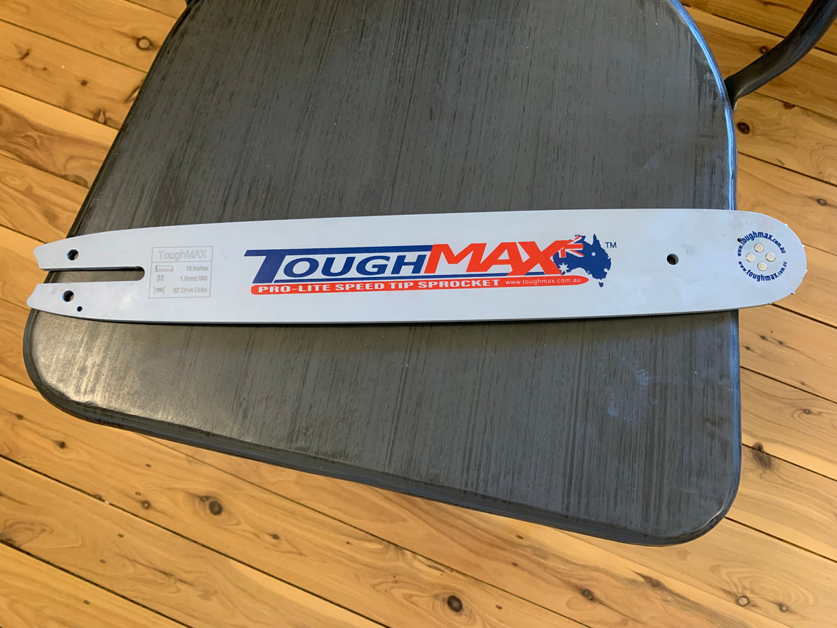 Chainsaw guide bar mount end showing bar slot and oil holes